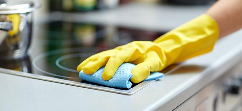 hand cleaning cooker countertop